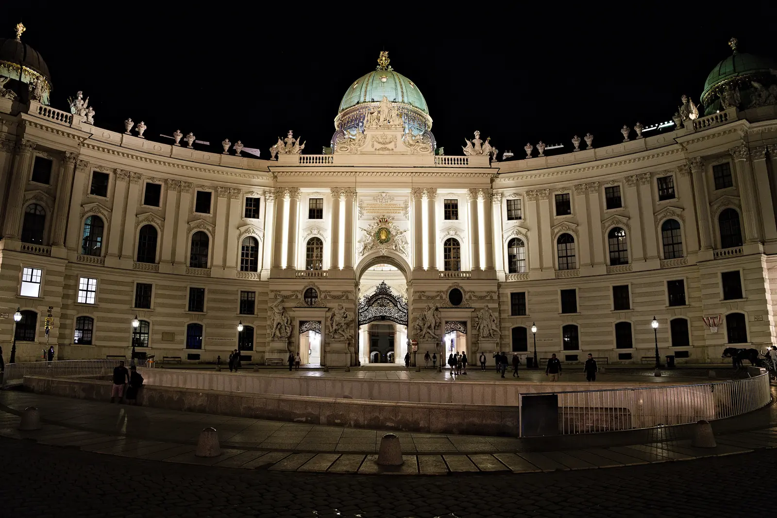 The Michaelertrakt of the Hofburg in Vienna, lit at night