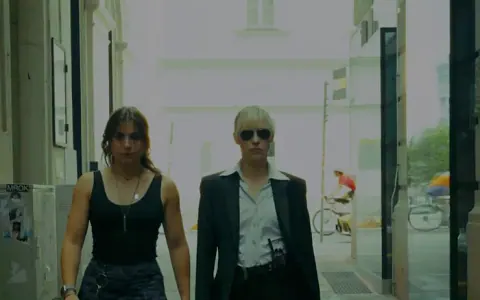 Two agents walking down a Viennese alley