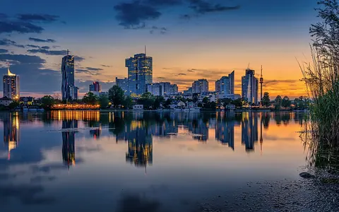 Vienna skyline by the Old Danube at dusk