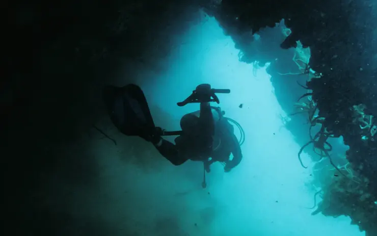 Diver in an underwater cave on the Deep Sea special mission